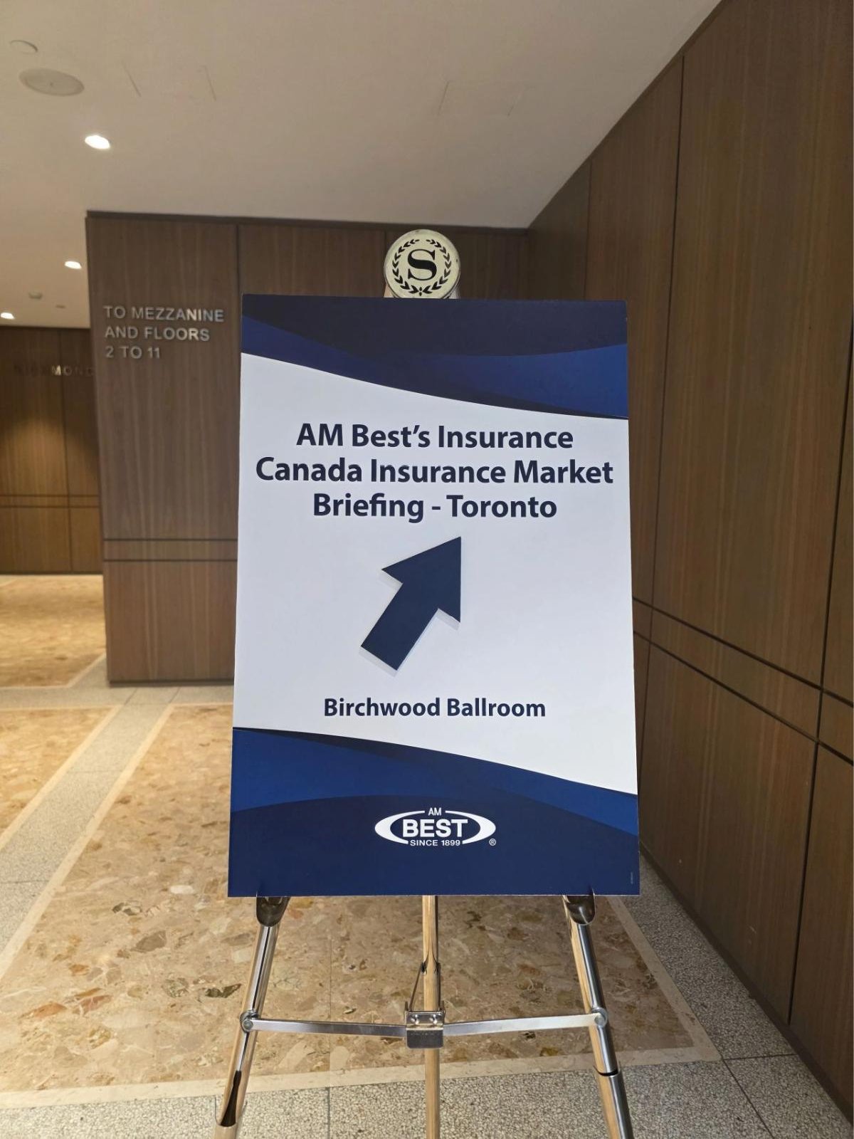 Sign for AM Best's Canada Insurance Market Briefing in Toronto pointing to the Birchwood Ballroom at the Sheraton Centre Toronto