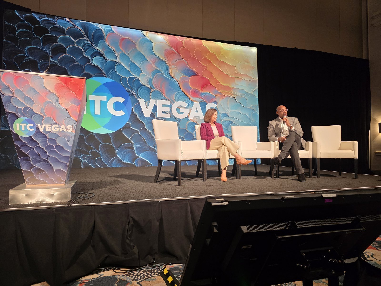 Marina Barg, Chief Claims Officer, U.S., Ascot Group, and Jermaine Everett of Bevaya on stage at ITC Vegas 2026 discussing agentic AI in specialty claims intake.